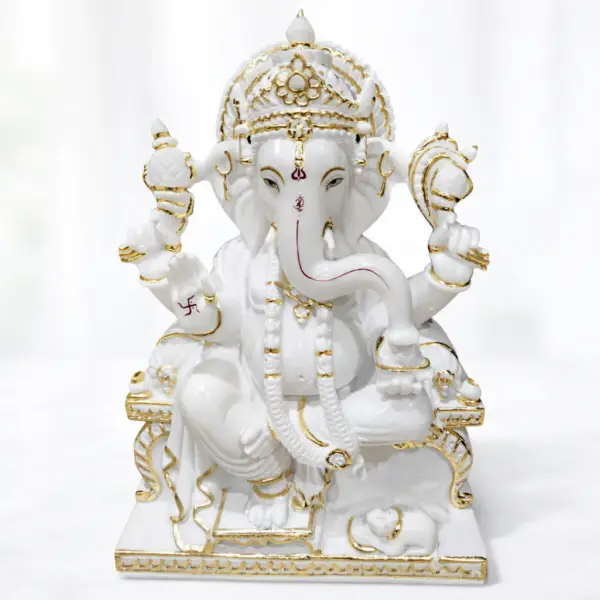 White marble Ganesh Ji moorti with gold detailing for home temple and pooja room