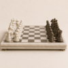 Luxury marble chess set with white and dark marble pieces on a polished marble board.