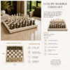 Luxury marble chess set displayed on a coffee table in an elegant living room setting.