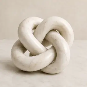 Marble knot sculpture product infographic showing material, features, dimensions, and care instructions.
