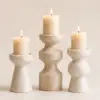 Set of sculptural marble candle holders with dimensions, features, and product details.
